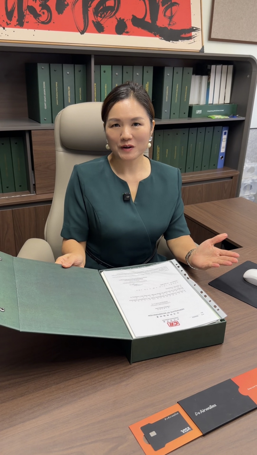 A Luminos team member opens the green folder to present the company documents