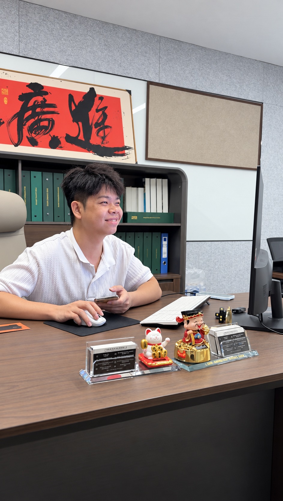 A Luminos team member working at his desk